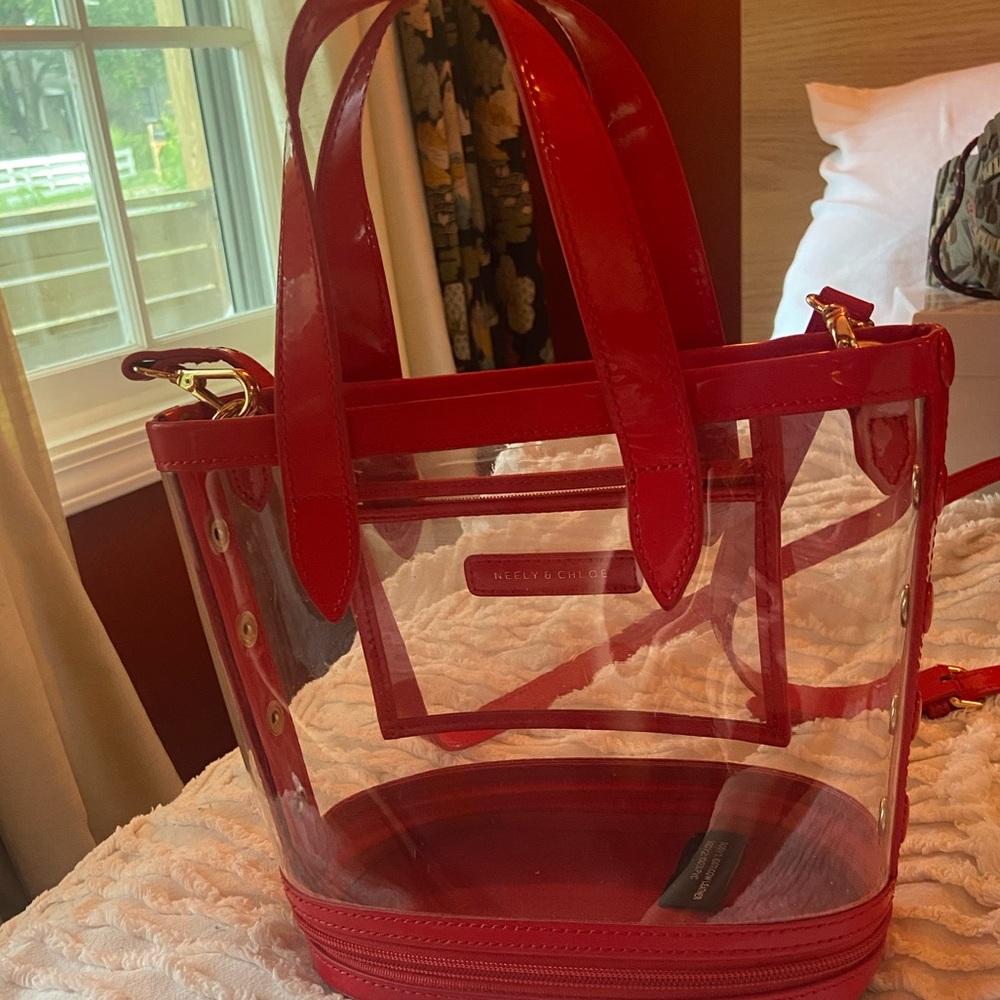 Clear and red patent leather purse
